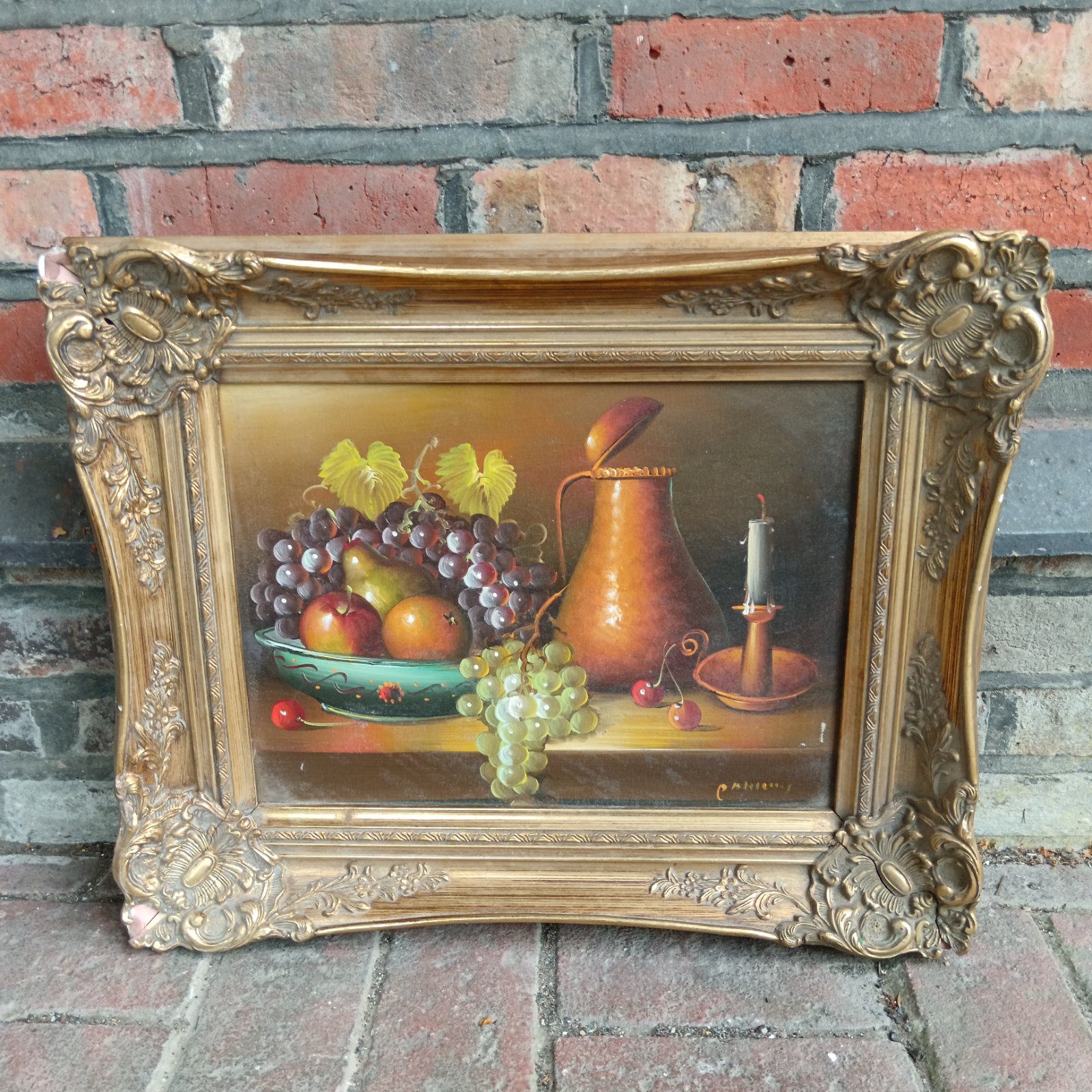 Vintage still life oil painting of fruit in a gilt frame.