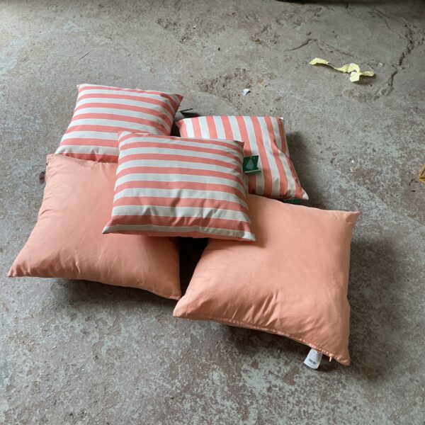 Striped garden cushions for comfortable outdoor seating.