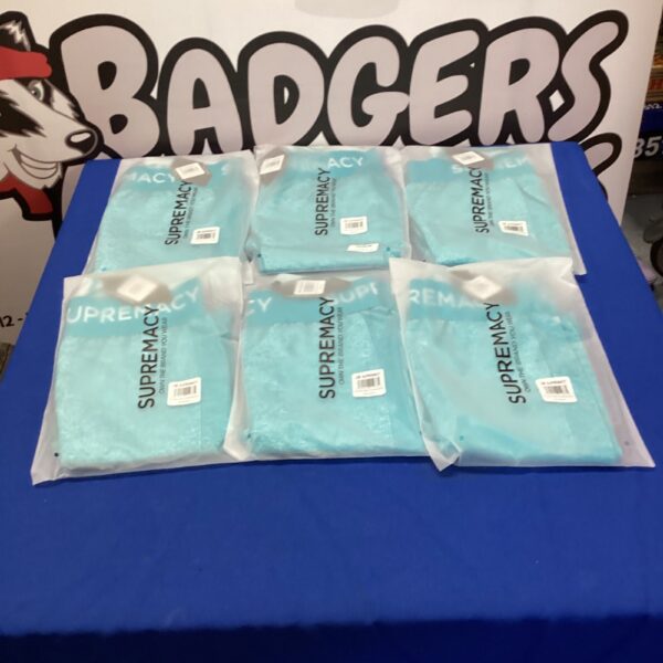 Lot of six new Supremacy gym leggings in packaging.