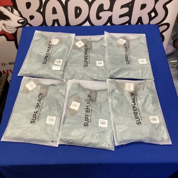 Lot of six new Supremacy gym wear tops in packaging.