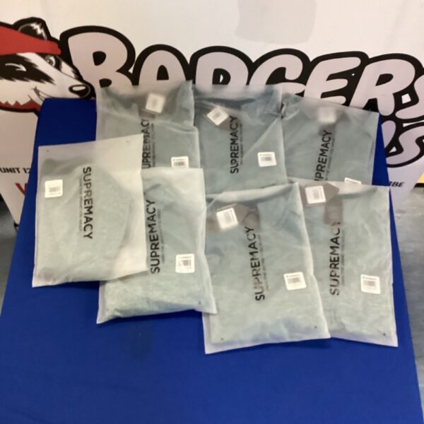 Lot of seven new Supreme cross crop tops in packaging.