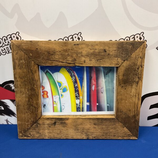 Framed print of colourful surfboards for coastal wall decor.