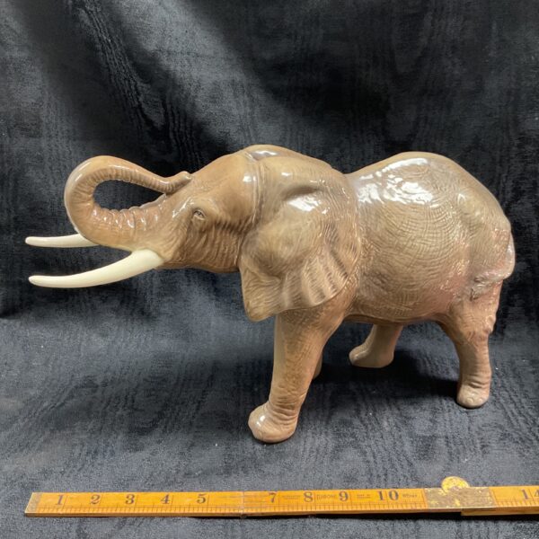 Large vintage Sylvac African elephant figurine in brown glaze.