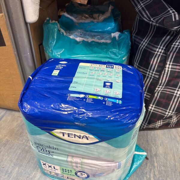 Sealed packs of Tena Proskin Slip Bariatric Pants XXL for incontinence.