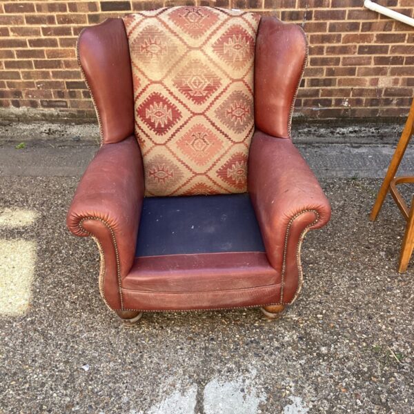 Brown leather Tetrad Eastwood armchair with Kilim fabric.