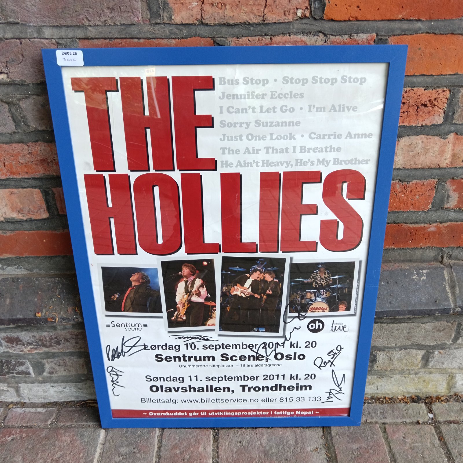 Vintage The Hollies signed concert poster, 1960s music memorabilia.