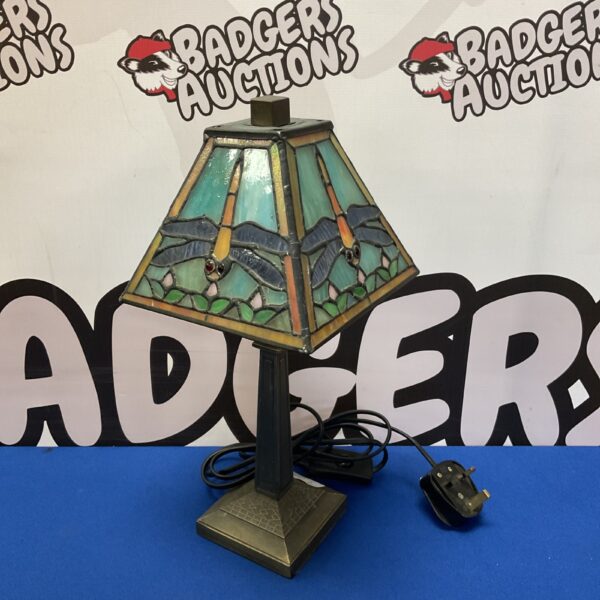 Vintage Tiffany style table lamp with dragonfly stained glass shade.