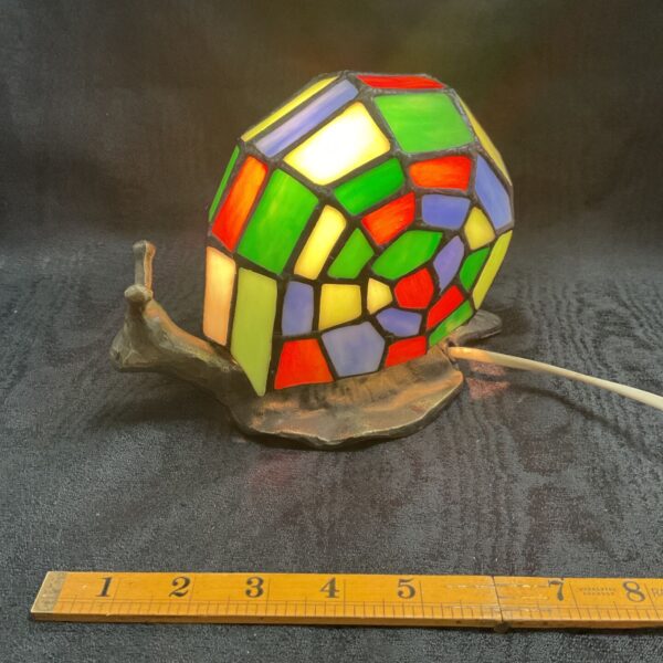 Colourful Tiffany style snail table lamp with stained glass shell.