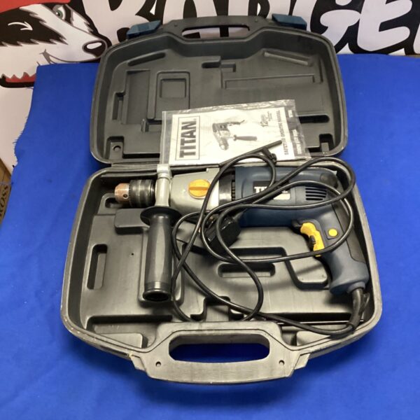 Titan impact drill in open carrying case, showing drill and accessories.
