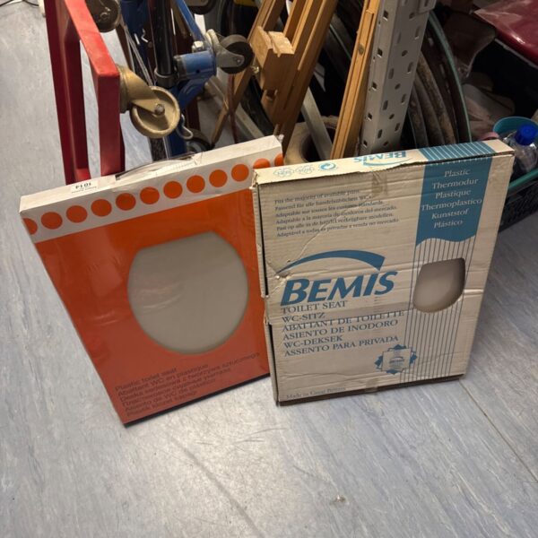 New Bemis plastic toilet seat in original packaging.