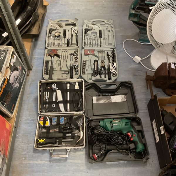 Tool kit collection featuring a Parkside electric hammer drill and hand tools.