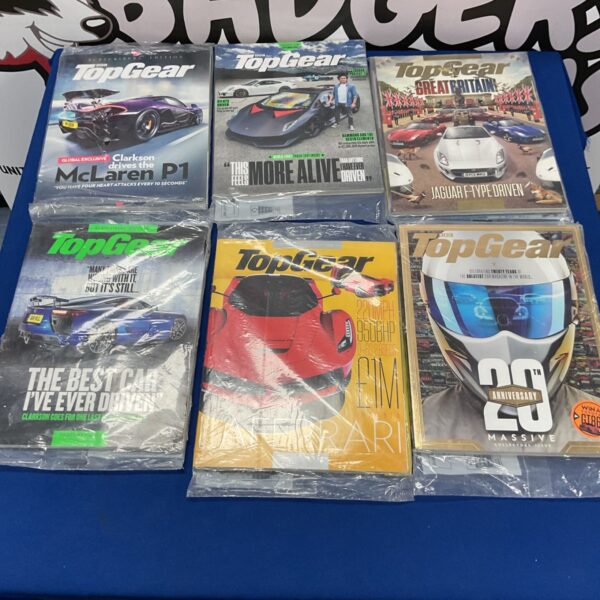Six collector's editions of Top Gear magazines in a collection.