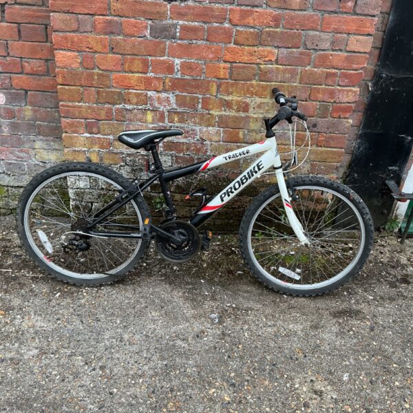 Black and white Tracker Probike mountain bicycle for adult riders.