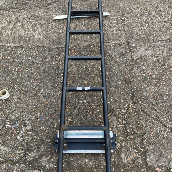 Metal transit van ladder, folded and ready for use.