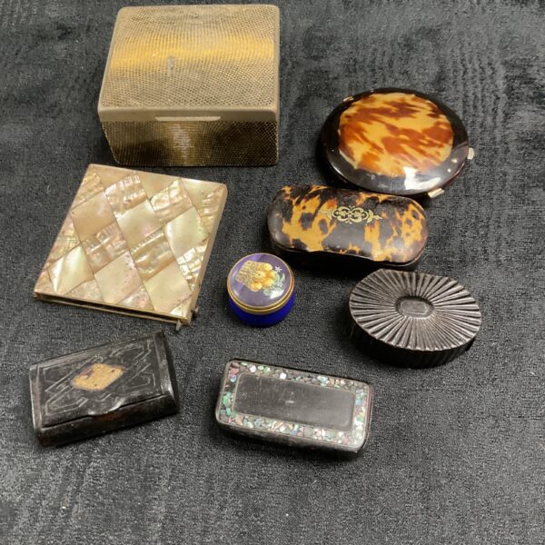 Assorted vintage trinket boxes with mother-of-pearl and tortoiseshell detailing.