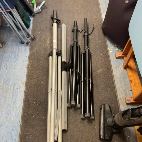 Lot of three collapsible tripod stands for photography lighting.