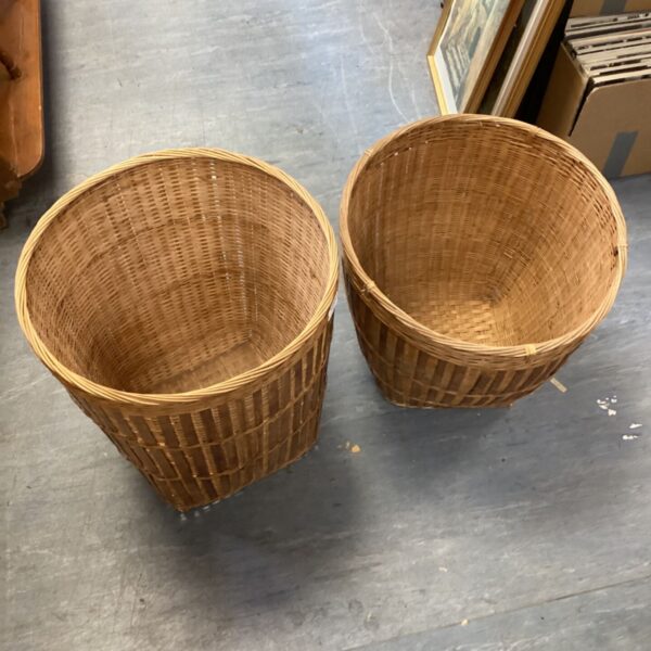 Two vintage wicker baskets for storage and rustic home decor.