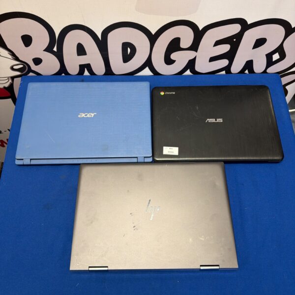 Used laptops lot including HP, Acer, and Asus models for repair.