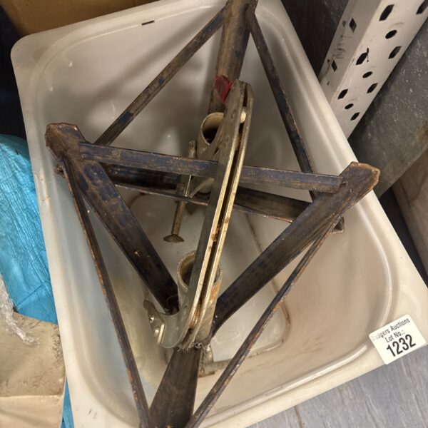 Valve spring compressor tool and axle stands for automotive repair.