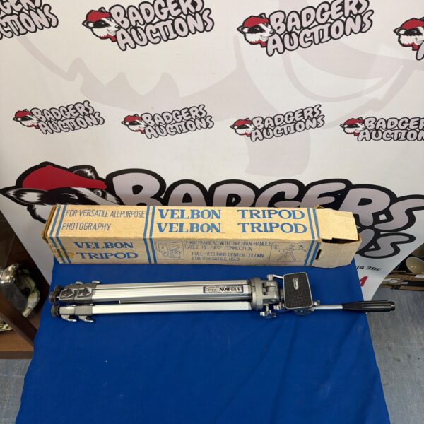 Vintage Velbon tripod for photography with three-way pan head.