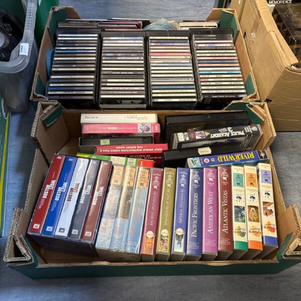 Mixed lot of VHS tapes and CDs for collectors.