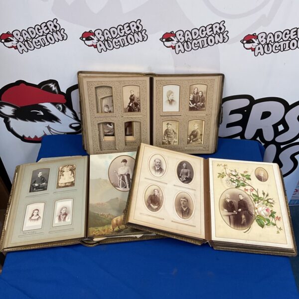 Group of three antique Victorian photo albums with faded photographs.