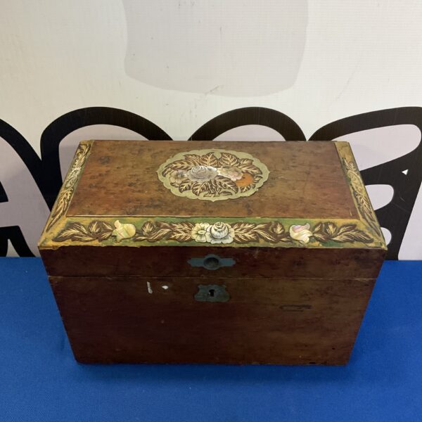 Antique Victorian tea caddy with mother of pearl inlay, front view.