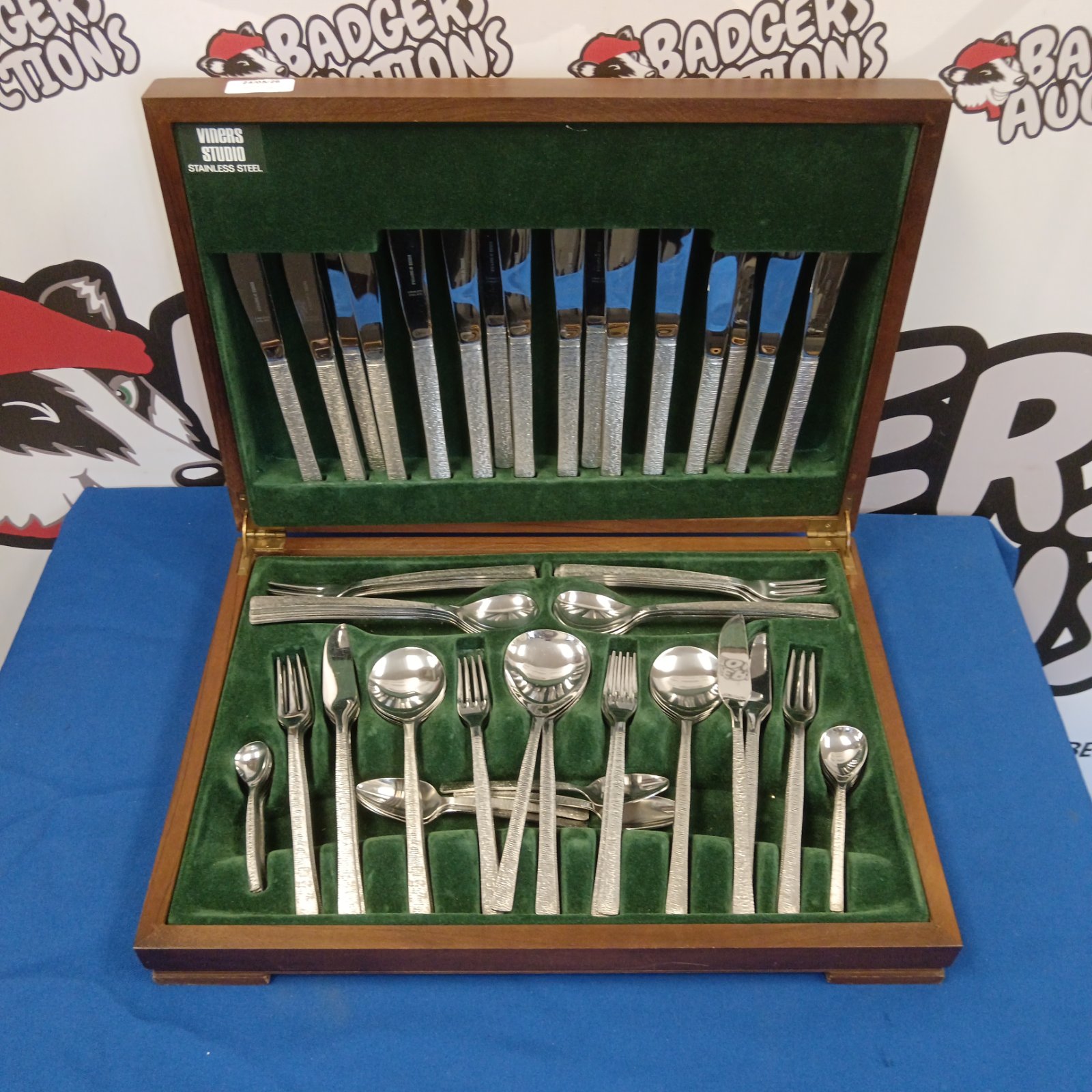 Vintage Viners Studio stainless steel cutlery set displayed in wooden case.