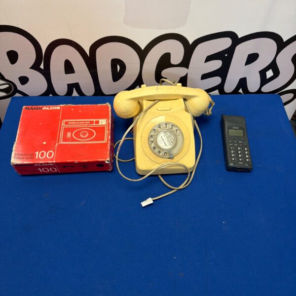 Vintage amber Aldis 100 telephone with rotary dial.