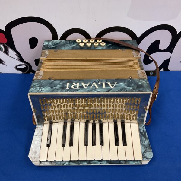 Vintage Alvari piano accordion with keys and buttons.