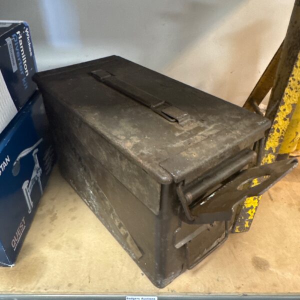 Vintage medium-sized metal ammo tin with latch.
