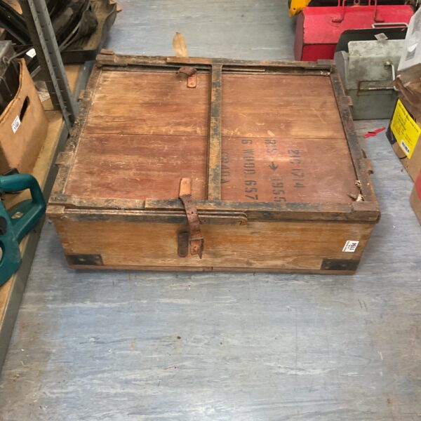 Vintage wooden ammunition crate with visible markings.