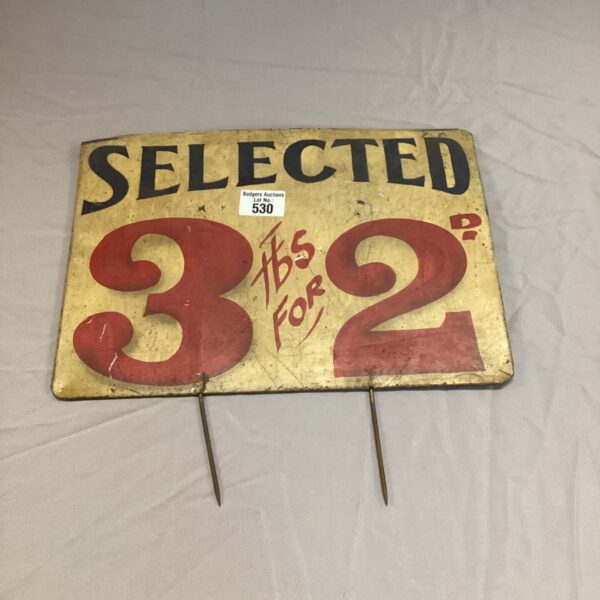 Vintage Amour sign advertising three tables for two discount offer.