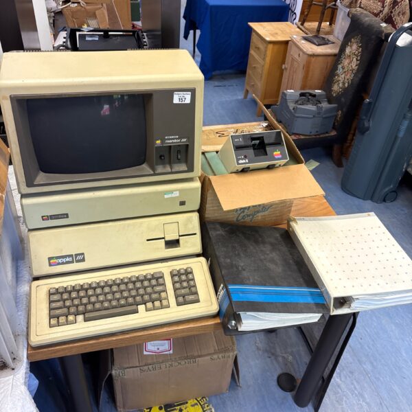 Vintage Apple III computer system with monitor and disk drive.