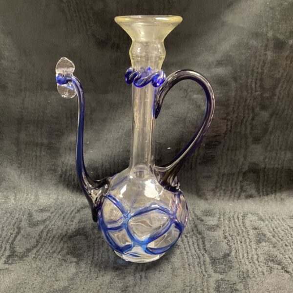 Vintage art glass amphora pitcher with blue glass details.