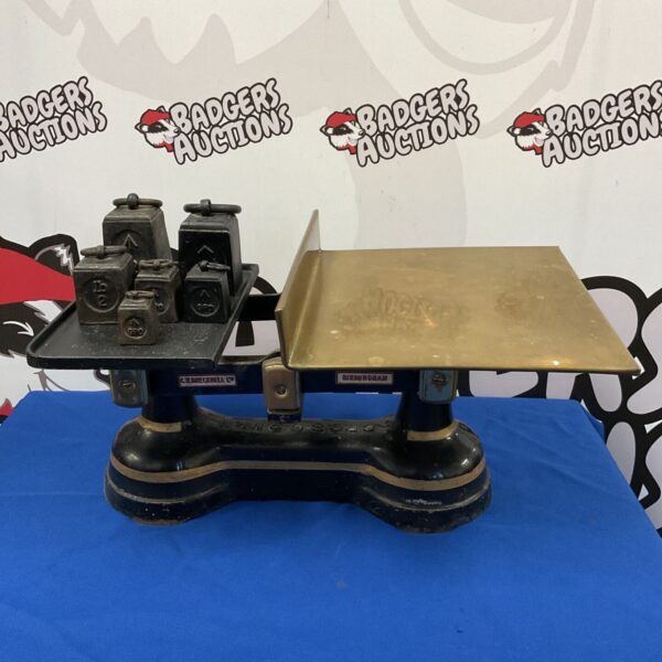 Vintage C W Brecknell GPO balance scales with weights, side view.