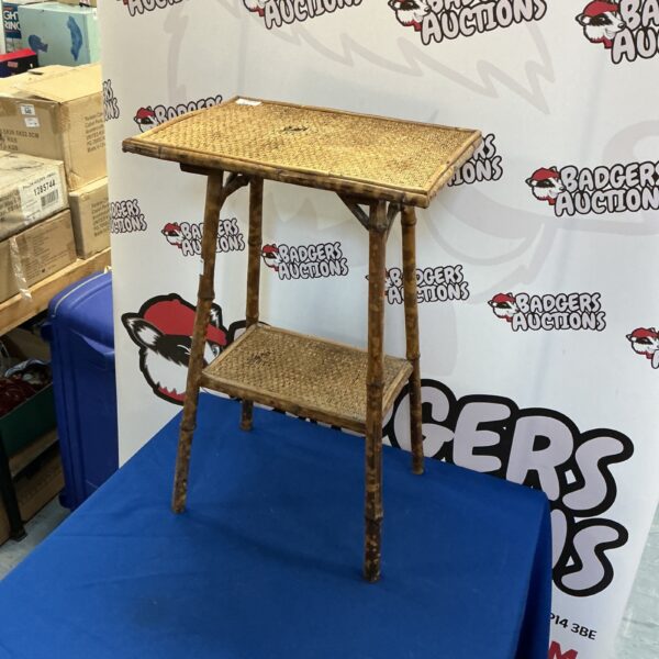 Vintage bamboo flower stand with tiered design for plant display.