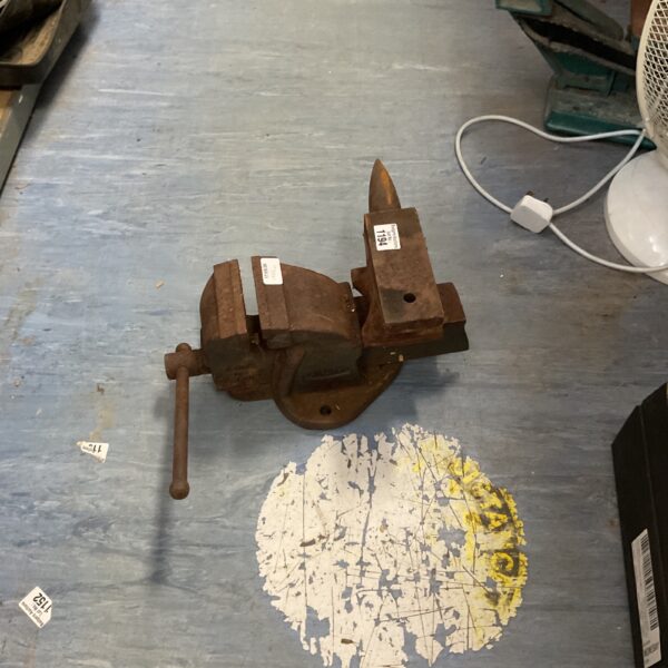Vintage bench vice, a robust metalworking tool for workshops.