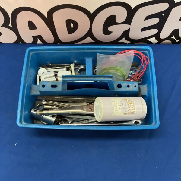 Vintage blue tool box filled with various hand tools.