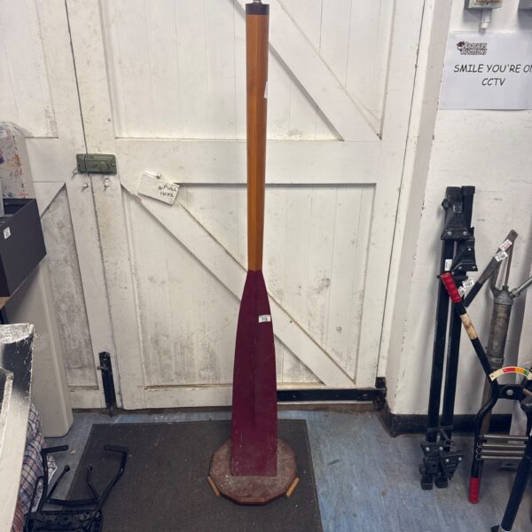 Vintage boat oar floor lamp in a room setting.