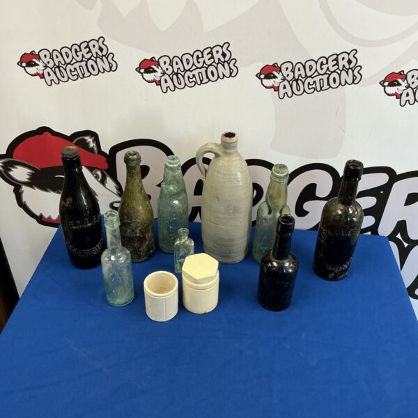 Vintage bottle collection featuring antique glass and ceramic bottles.