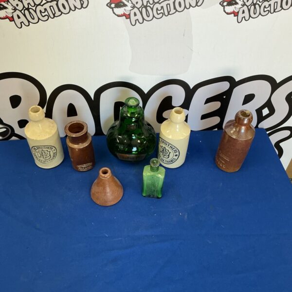 Selection of vintage bottles, antique glass, collectible items.