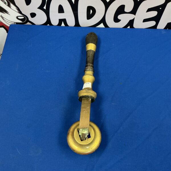 Vintage brass beer pump handle for pub or bar decor.