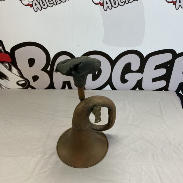 Vintage brass car horn, a classic antique automobile part.