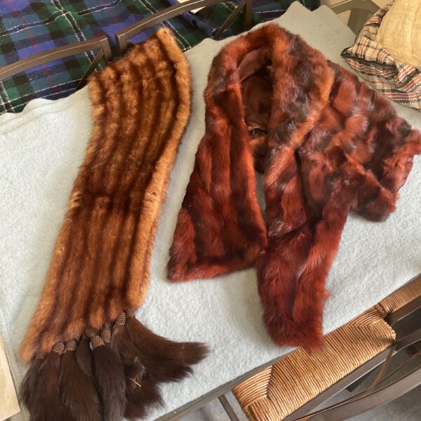 Vintage brown fur stole draped on a chair.