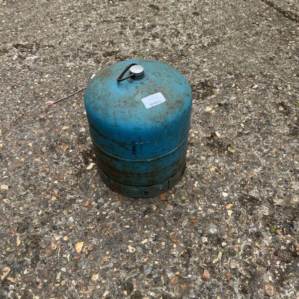 Vintage camping gas bottle, small metal canister for outdoor use.