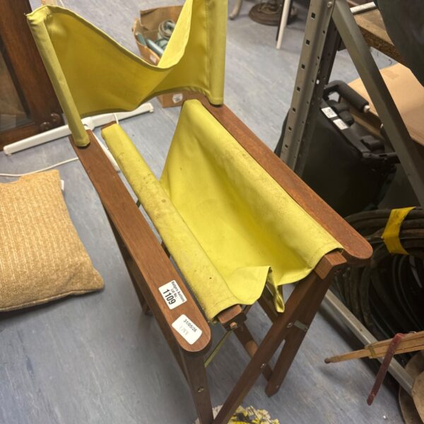 Vintage wooden framed canvas camping seat, folded.