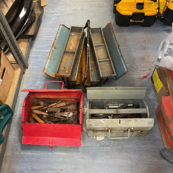 Set of three vintage metal cantilever toolboxes for tool storage.