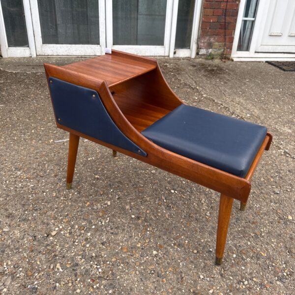 Vintage Chippy Heath teak telephone table with blue padding.