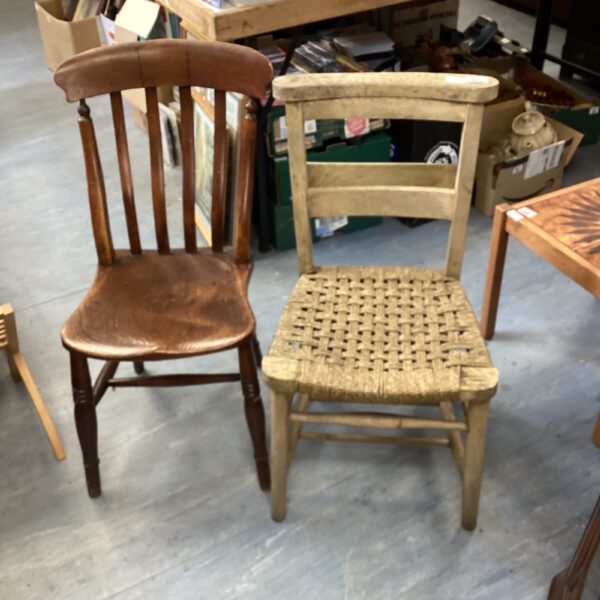Pair of vintage church chairs with woven and solid seats.